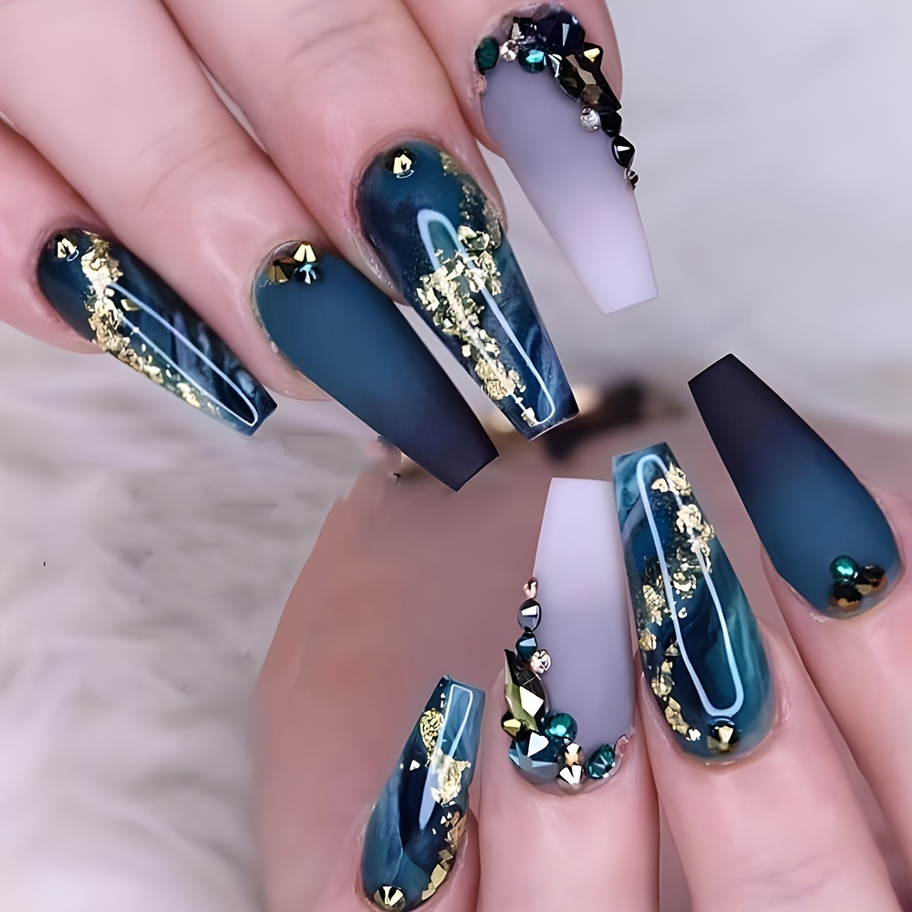 Long blue and lavender nail set with gold foil accents and rhinestones